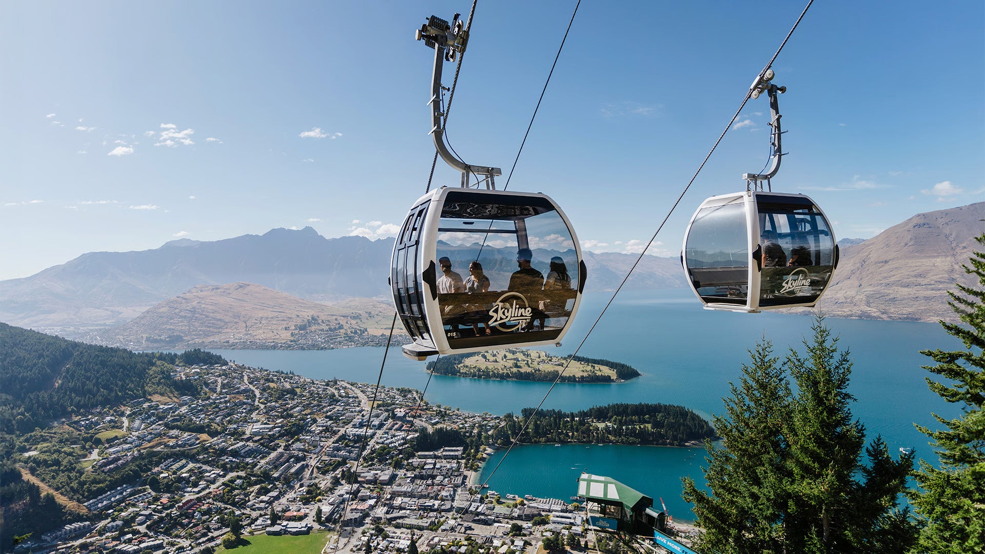 Skyline gondola rising over Queenstown